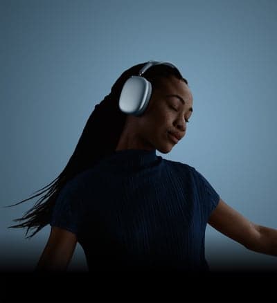 Serene Immersion: Woman with Silver Over-Ear Headphones