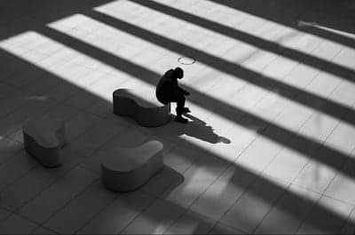 Solitary Figure in Architectural Light