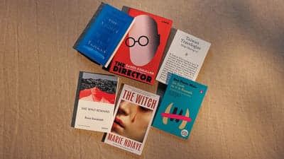 Collection of Modern Book Covers on Textured Surface