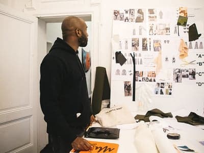 Fashion Designer Reviewing Mood Board in Studio