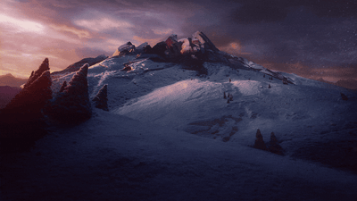 Cinematic Snow-Covered Mountain Peak at Sunset