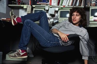 Woman in a 1980s Tech Workspace