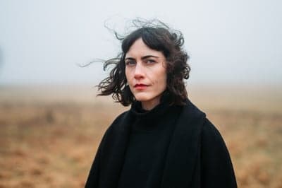 Atmospheric Portrait in a Misty Field