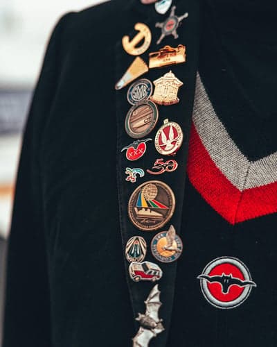 Collection of Enamel Pins on a Black Blazer Lapel