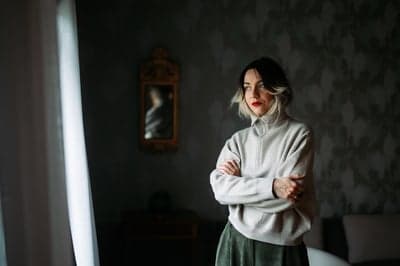 Introspective Woman in a Moody Interior