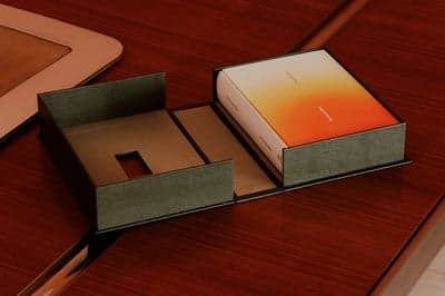 Minimalist Packaging with Gradient Book on Wood Table