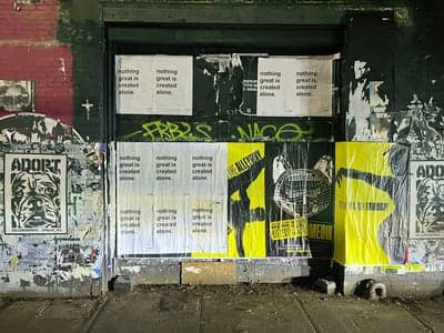 Gritty Urban Wall with Layered Street Art