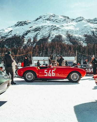 Vintage Ferrari Racing on Snow in the Alps